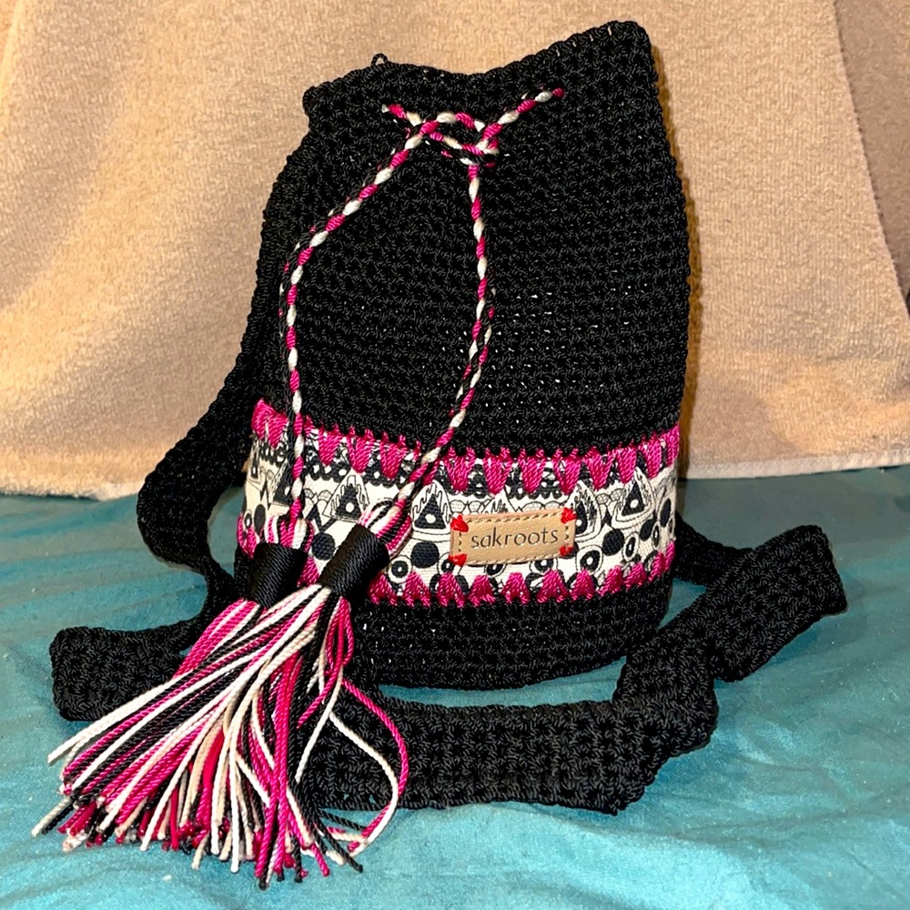 Sakroots woven bucket-style purse with cinch top.